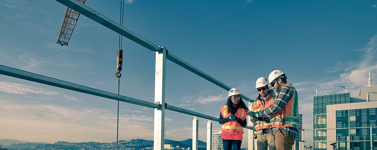 Construction workers on a construction site using Autodesk