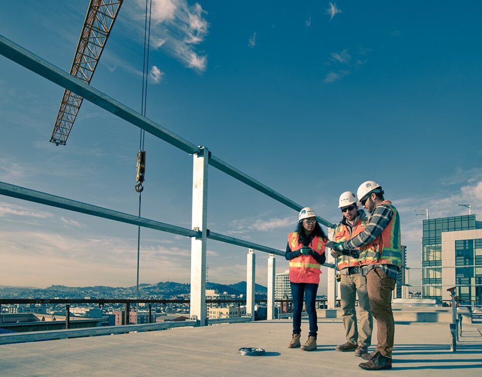 Construction workers on a construction site using Autodesk